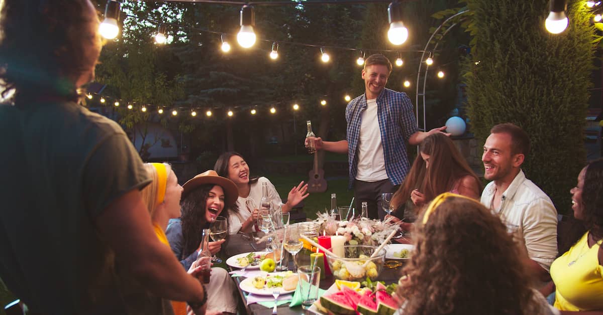 Friends drinking at backyard party. | Maggiano, DiGirolamo & Lizzi